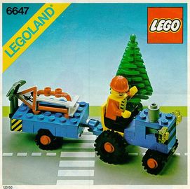 Traktor mit Hänger und Arbeiter